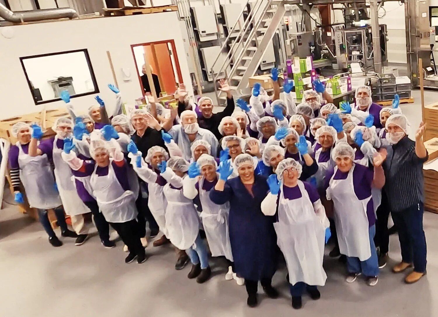 The Double Date Packing team waving on the packing floor